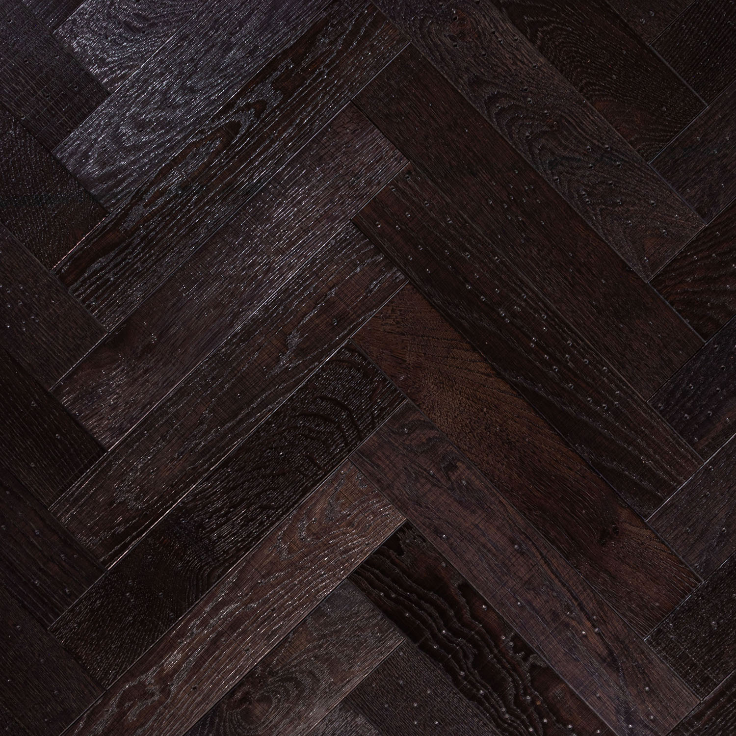 Dark espresso Goose Pen Lane oak parquet flooring with distressed texture.