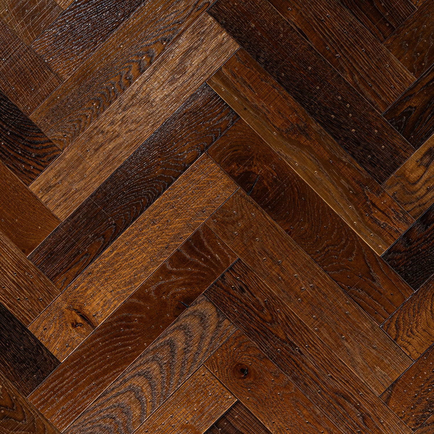 Smedley Close medium brown herringbone oak blocks with tumbled edge detail.
