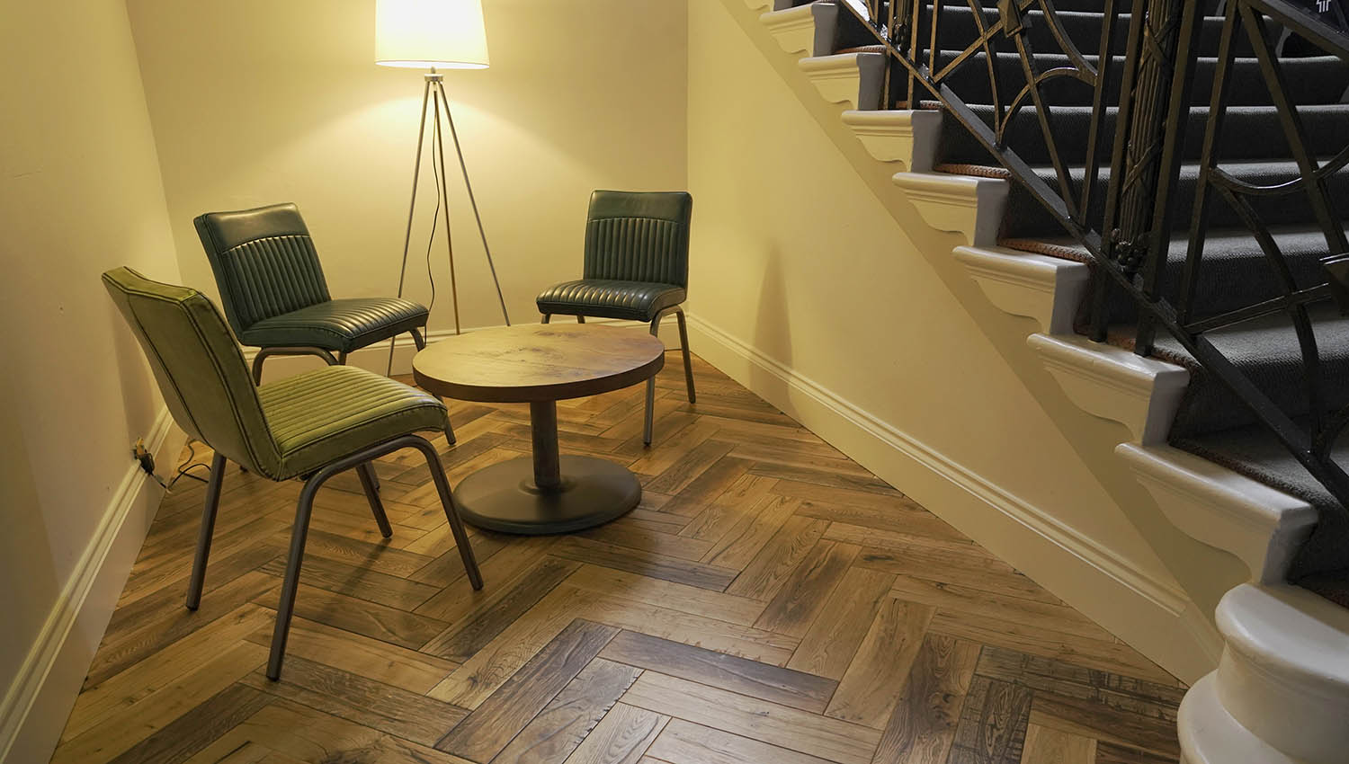 Herringbone wood flooring fitted in a small space