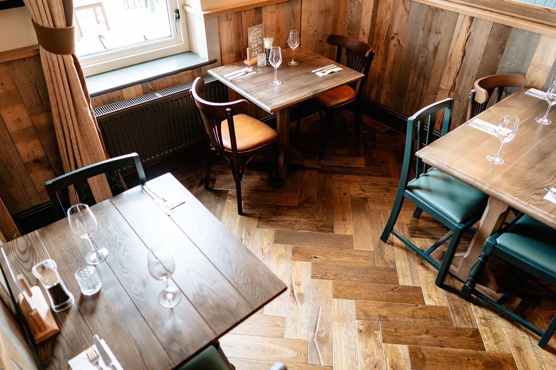 Traditional parquet flooring in hospitality interior.