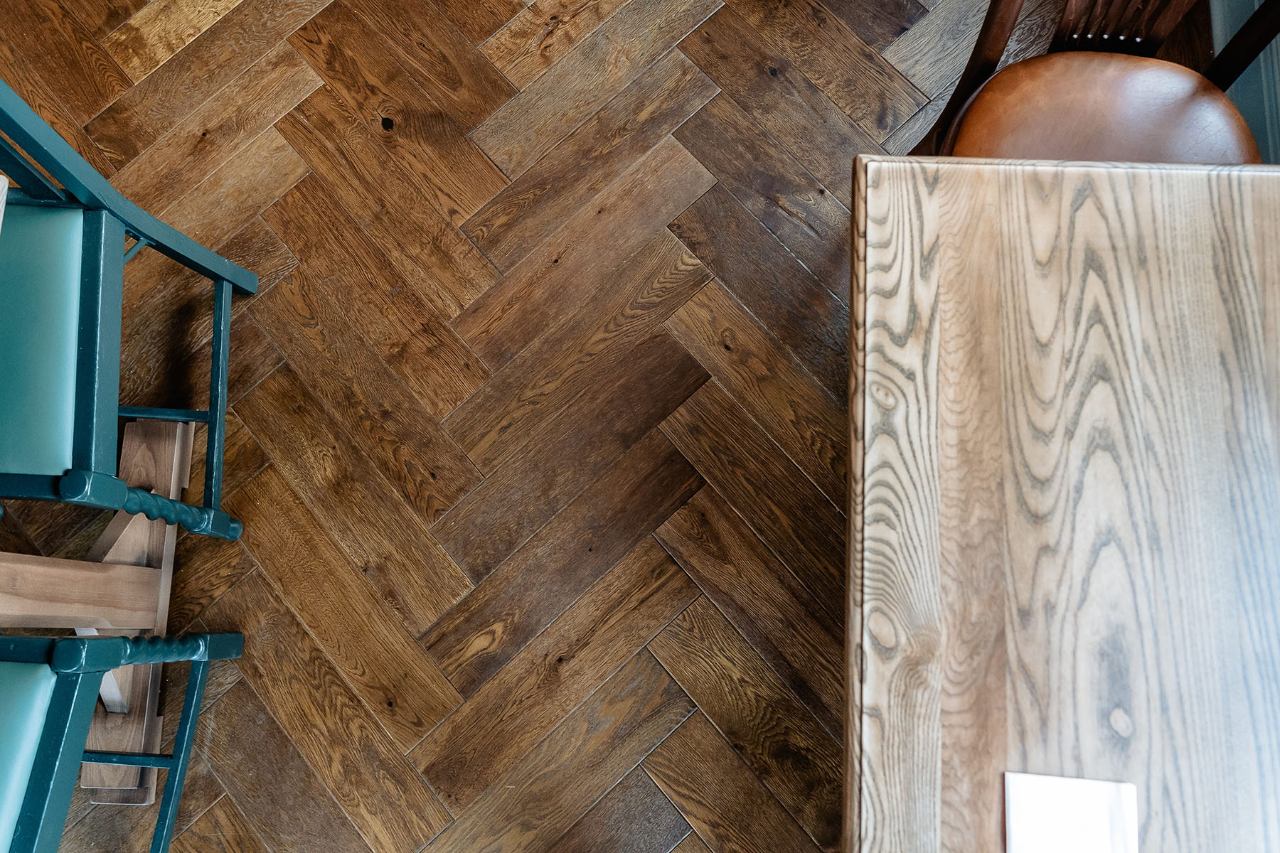 Traditional parquet flooring in hospitality interior.