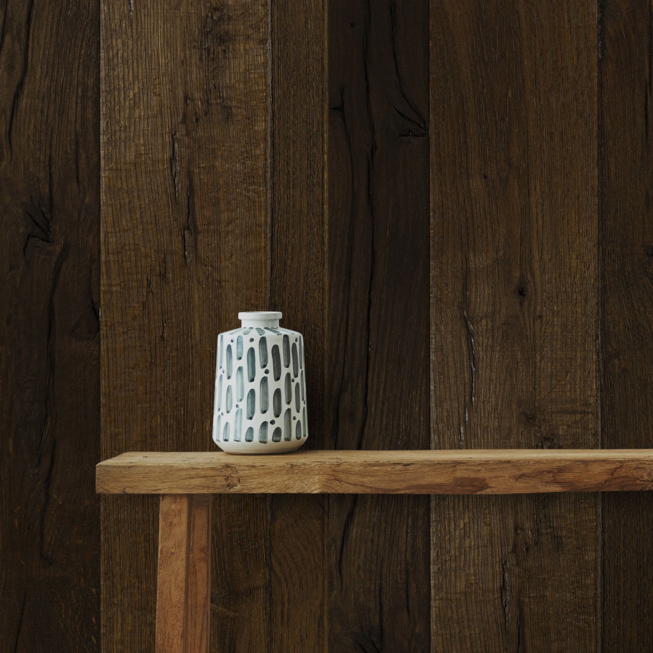 Engineered oak cladding in chocolate tones.