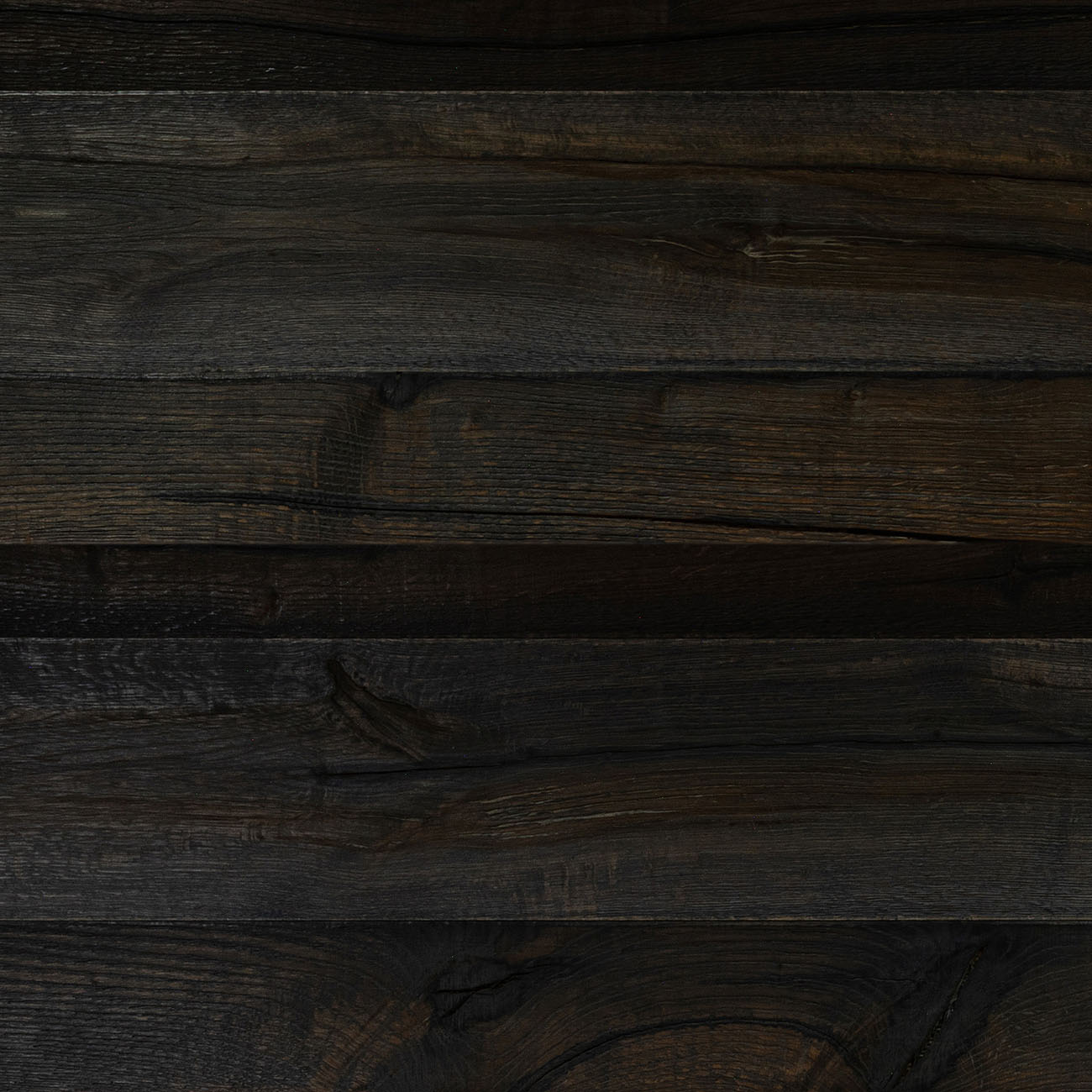Ewden Close almost-black oak wall cladding with brown undertones.
