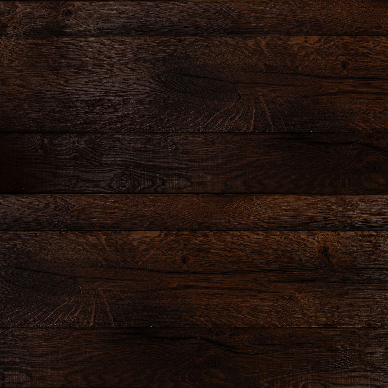 Haven Grove cladding in rich dark chocolate tones with a rustic texture.