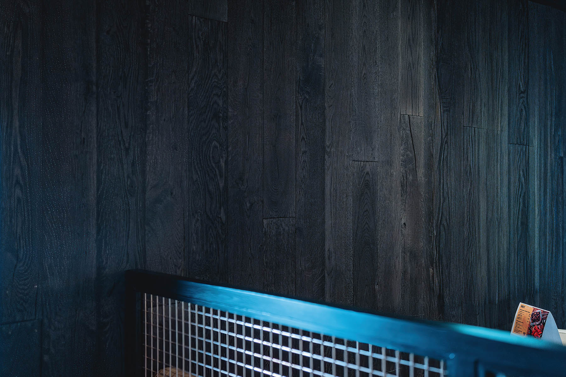 Rustic oak wall panels in modern pub restaurant design