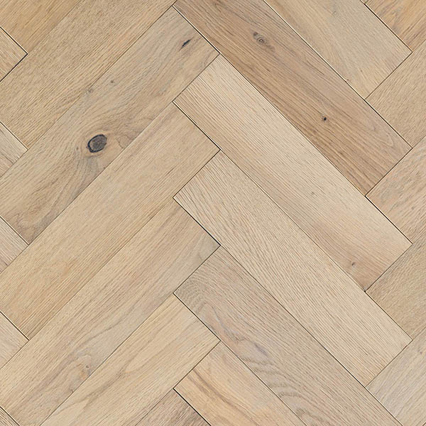 Unfinished herringbone wood floor with distressed surface treatment