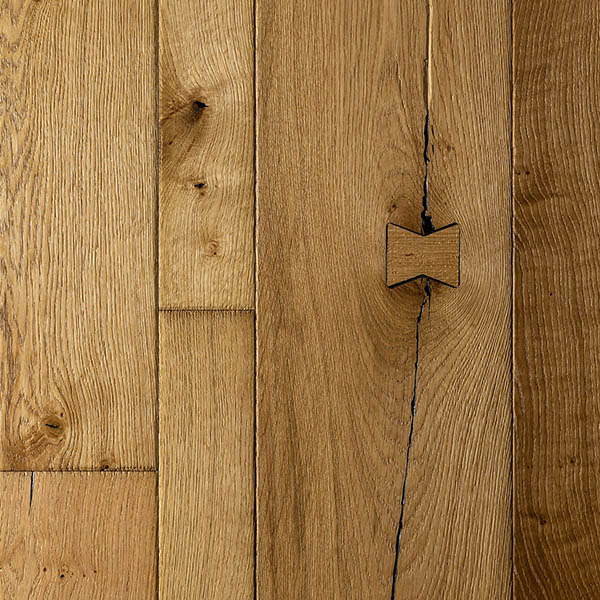 Cobble edged random width wood floor made from rustic grade engineered oak