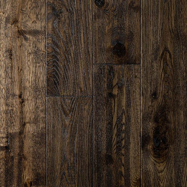 Wide plank wood floor made from engineered oak with distressed surface and finished with UV oil