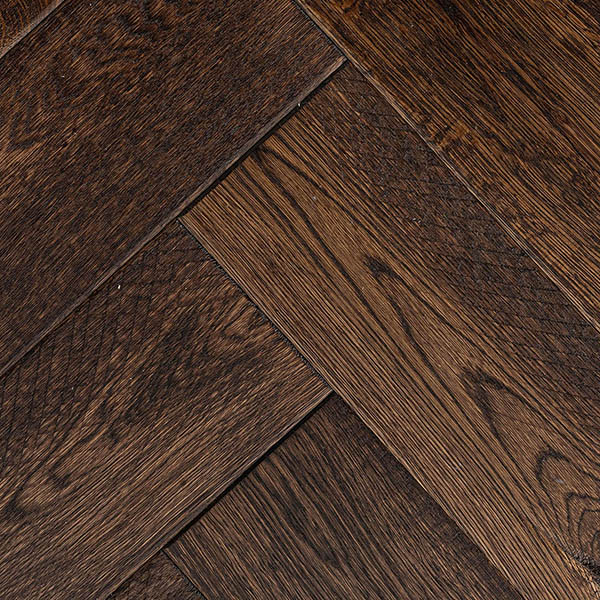 Dark distressed herringbone wood floor made from engineered European oak