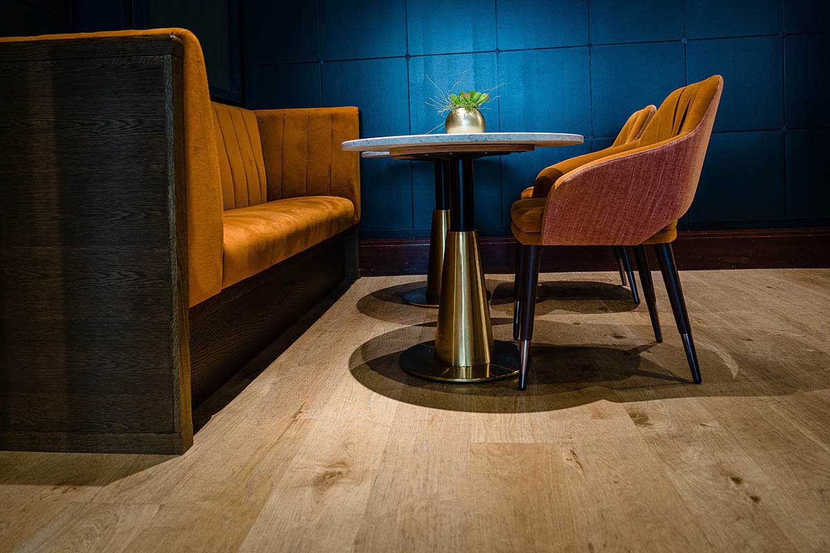 Plank wood flooring made from engineered European oak in a pub.