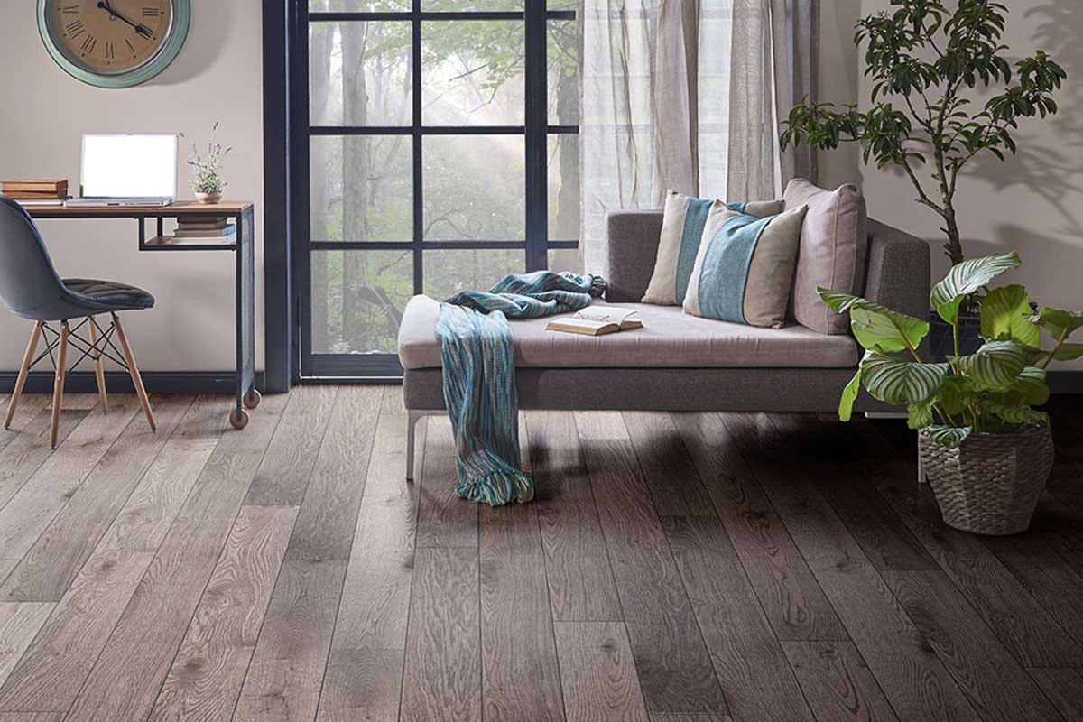 Modern Herringbone engineered wood floor inside an open-plan restaurant.