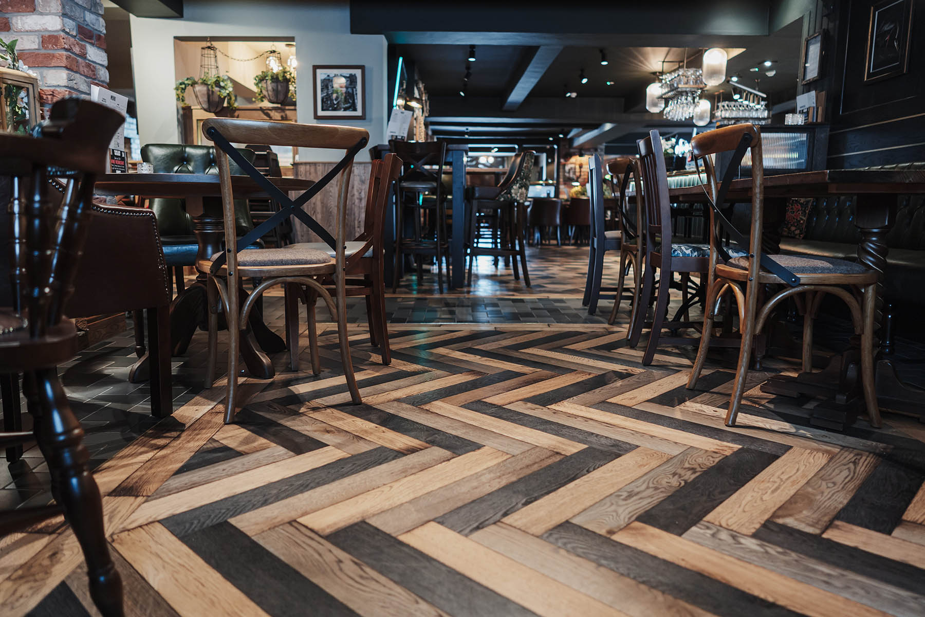 Pub interior featuring bespoke diamond and herringbone oak flooring by JackEvie