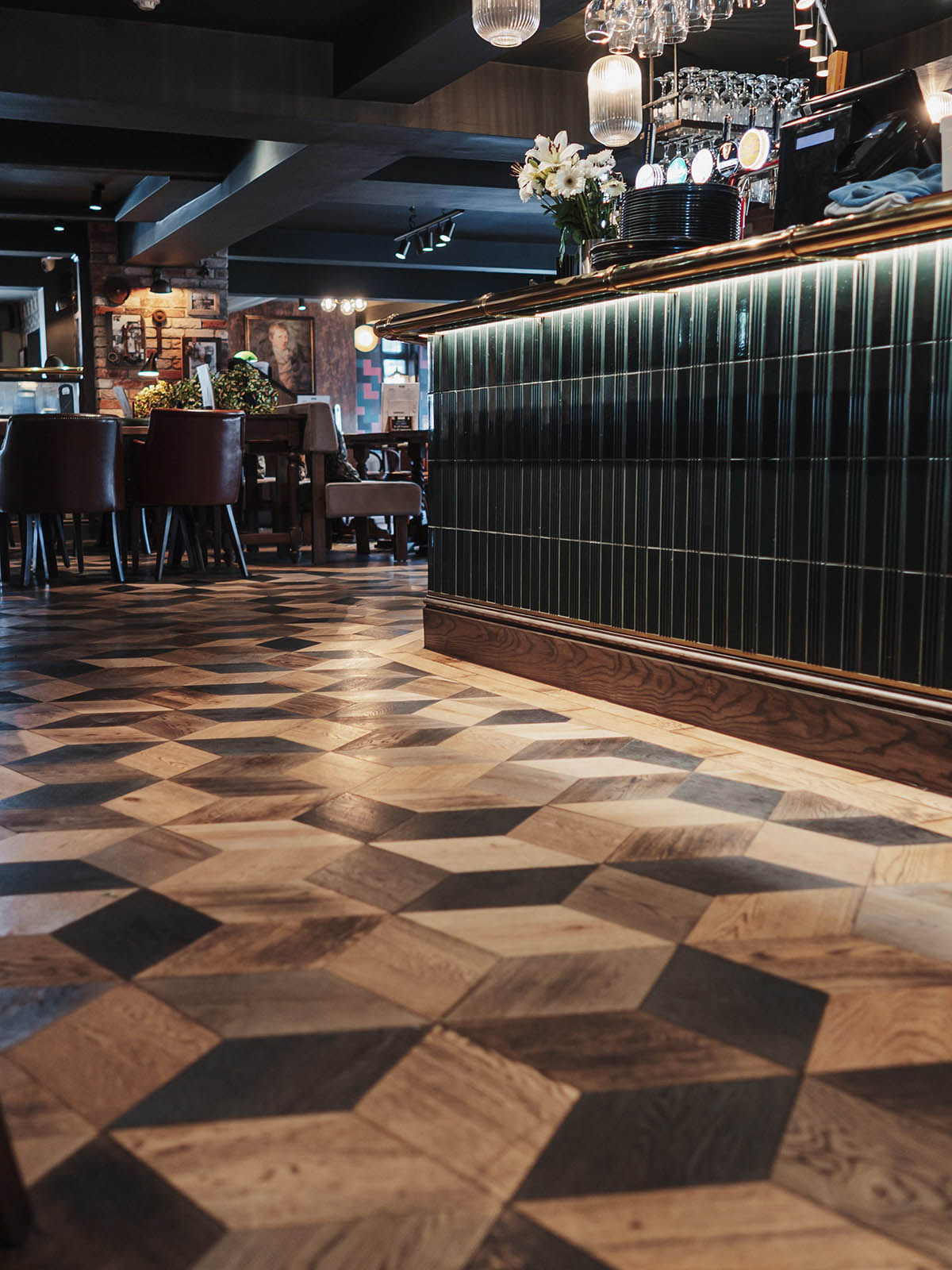 Pub interior featuring bespoke diamond and herringbone oak flooring by JackEvie.