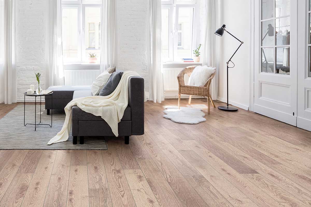 Modern Herringbone engineered wood floor inside an open-plan restaurant.