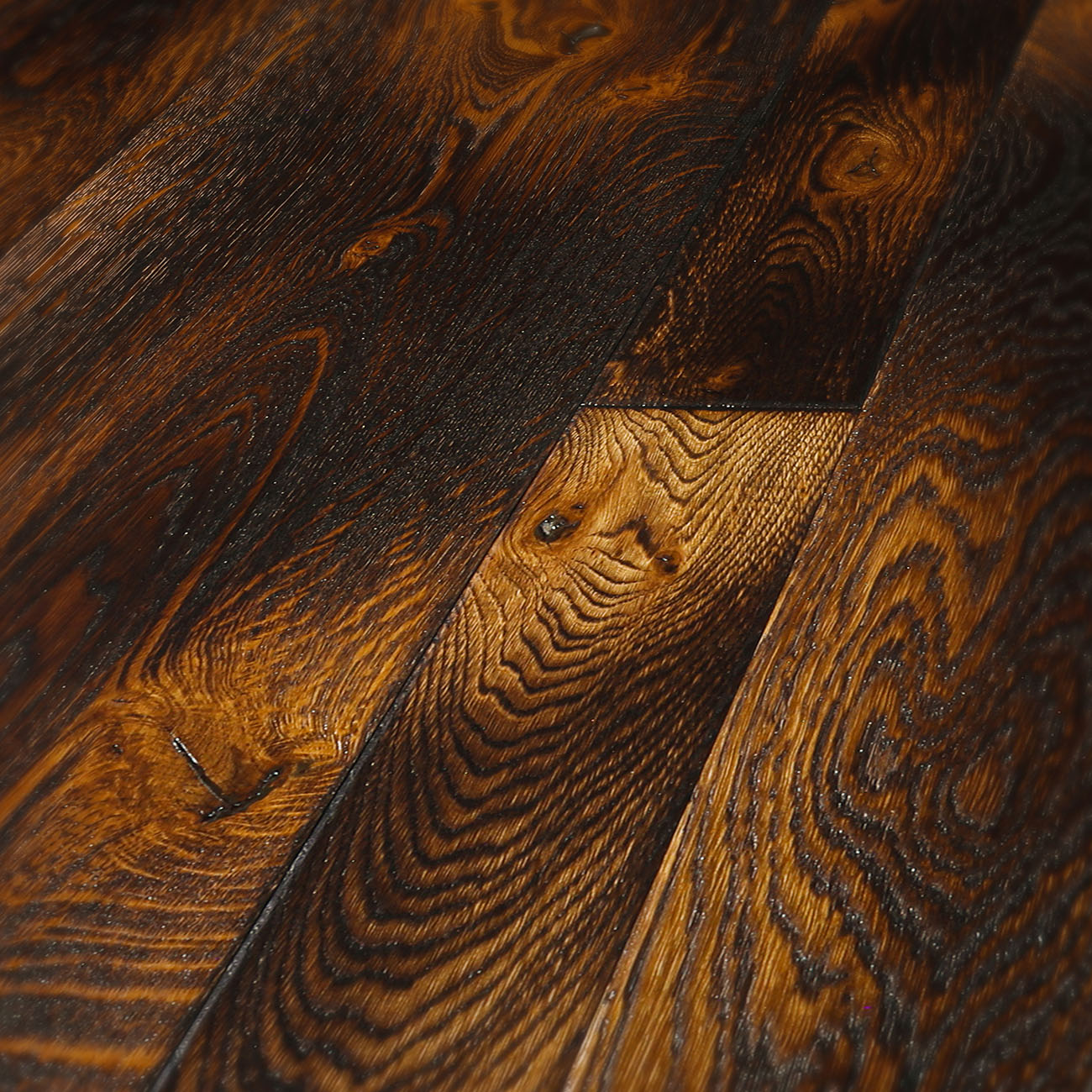 Rustic smoked oak floor with amber highlights.