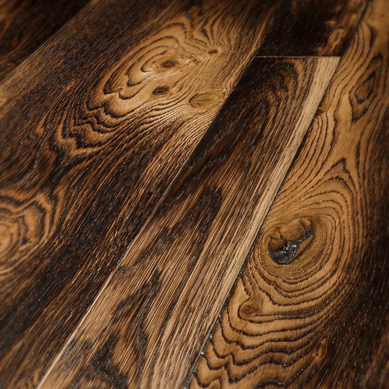 Rustic smoked oak floor with amber highlights.