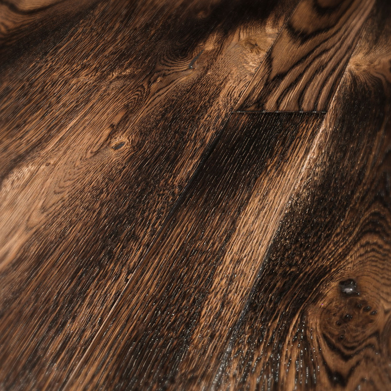 Rustic oak floor with cobbled edges and distressed texture.