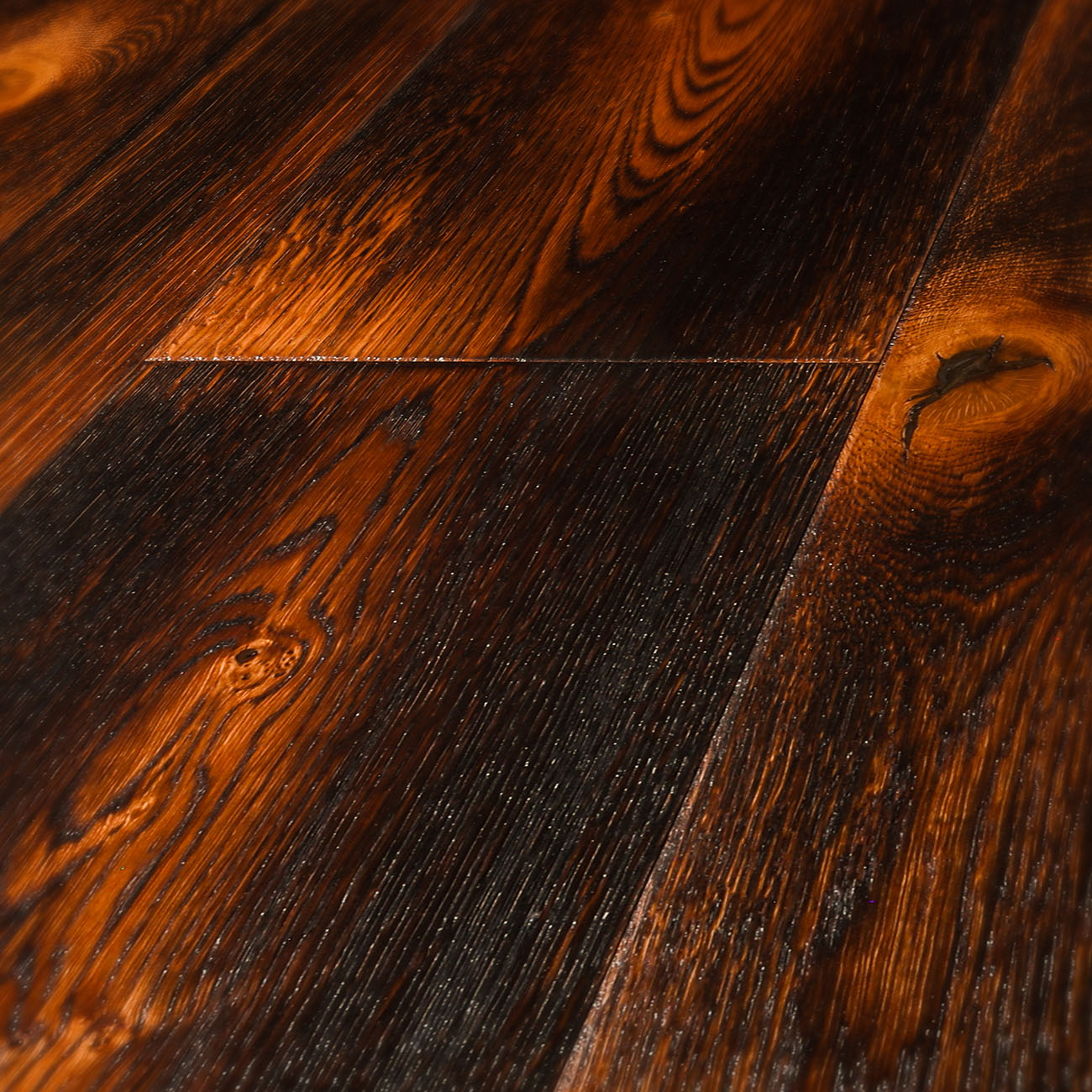 Smoked oak floor with amber undertones and knots.