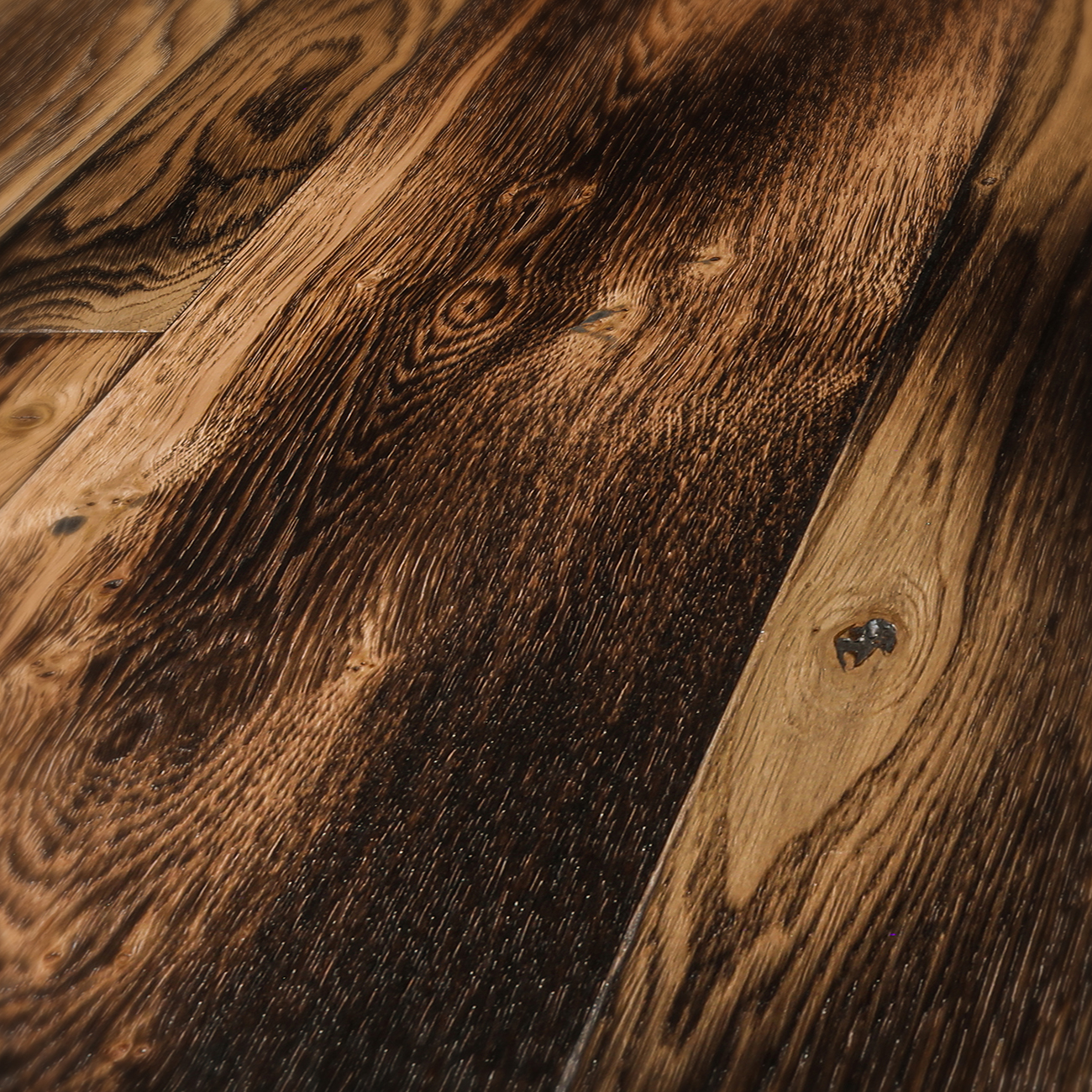 Smoked oak floor with amber undertones and knots.