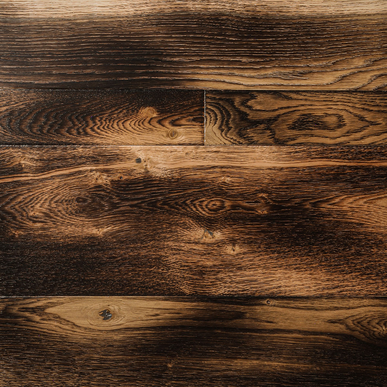 Delphinium Place burnt oak flooring with rustic detail.