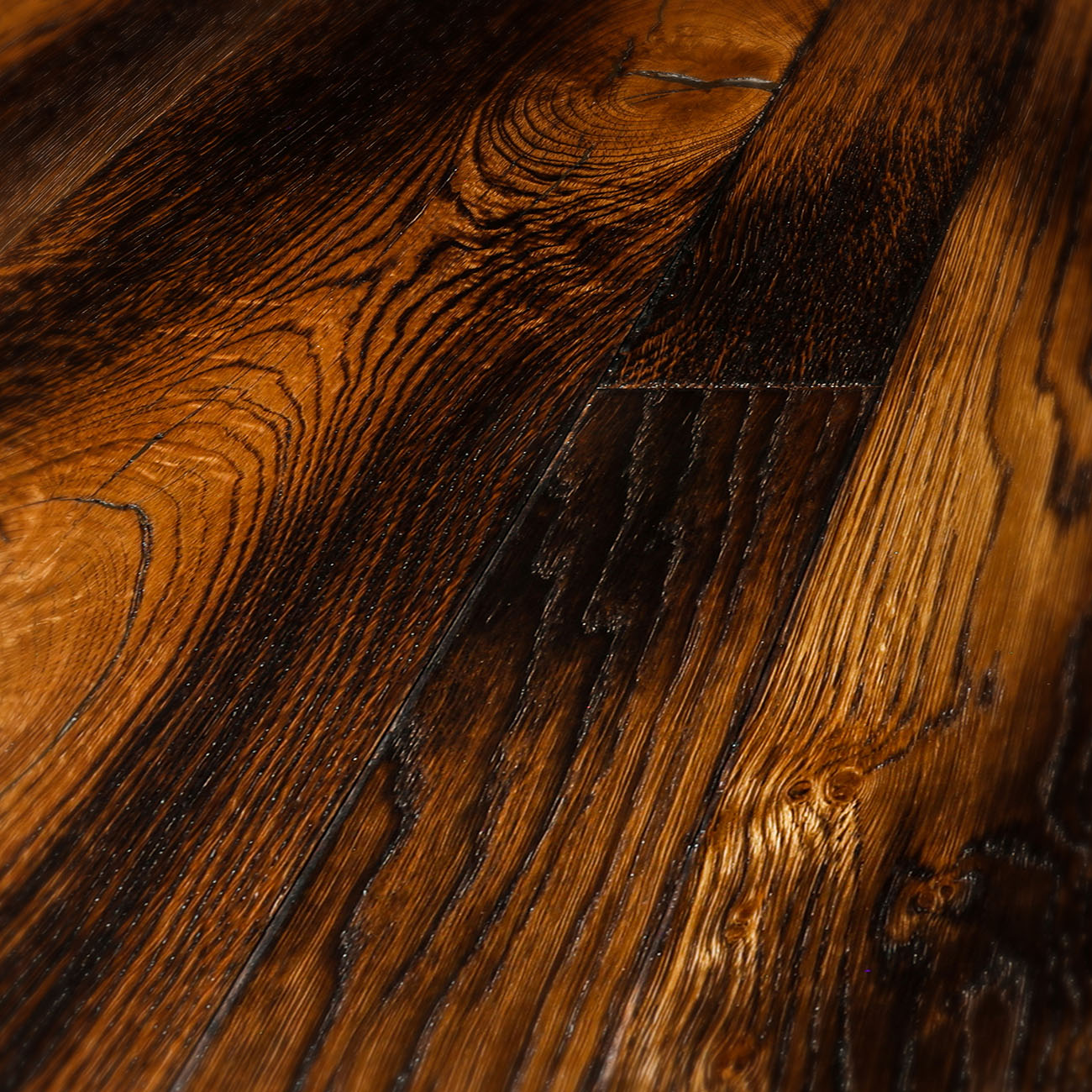 Smoked oak floor with amber undertones and knots.